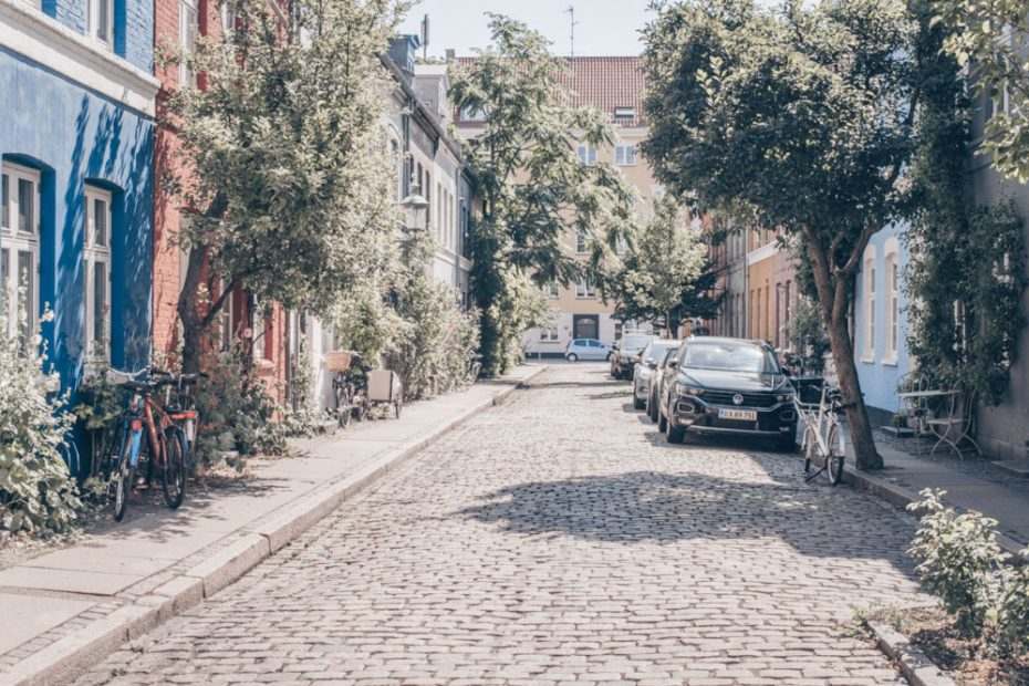3 Days in Copenhagen: Cars parked on a quiet, cobbled street in the center.