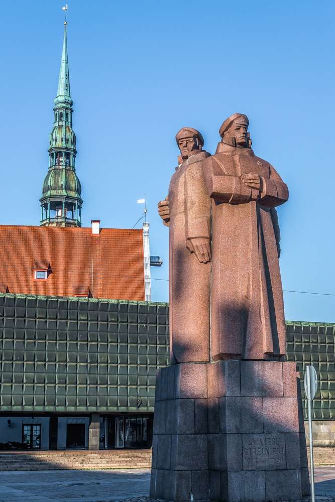 Free Self- Guided Riga Walking Tour: The three stern figures of the Riflemen Monument is one of the top things to see in Riga.