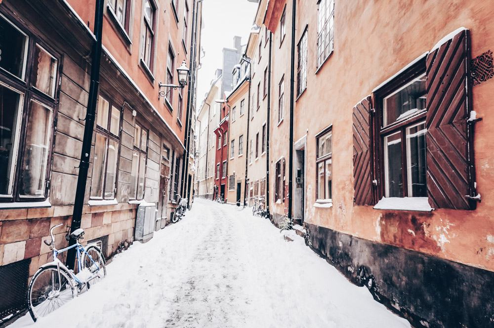 Stockholm must-see attractions: Snow covered cobblestone street of Prästgatan in Gamla Stan (Old Town)