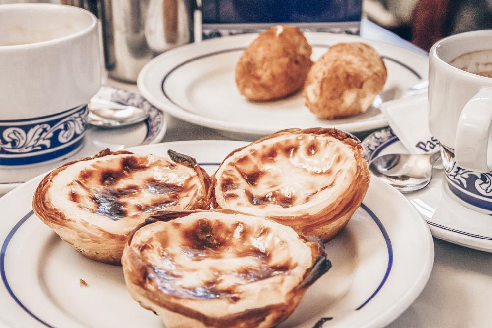 One day in Lisbon: Several pieces of pastel de nata, a creamy, flaky egg tart custard pastry.