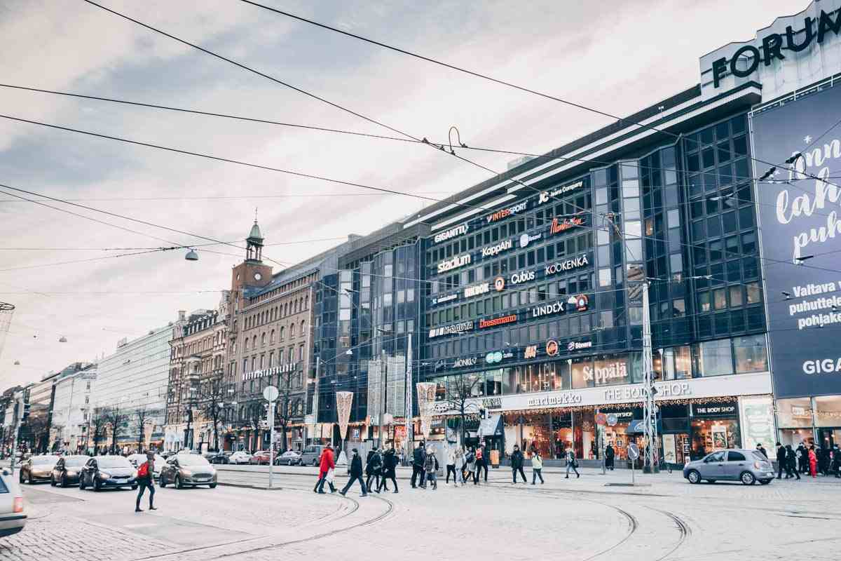 Things to do in Helsinki: People walking past commercial establishments on Mannerheimintie. PC: Grisha Bruev/shutterstock.com