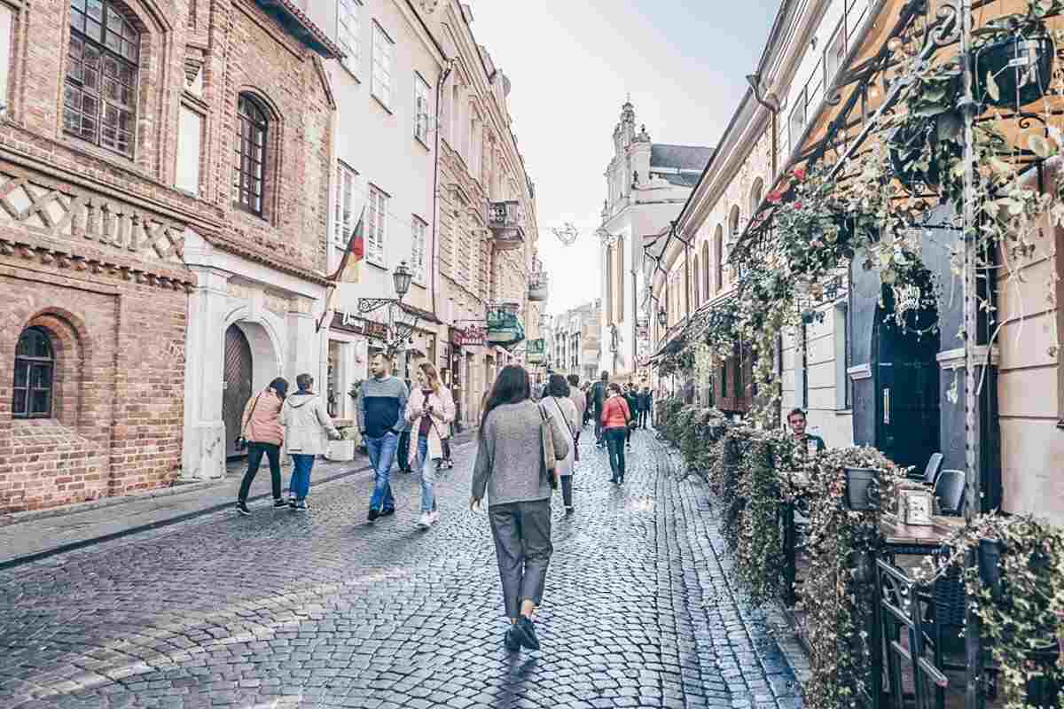 Vilnius must-see attractions: People walking along the cobblestone Pilies Street