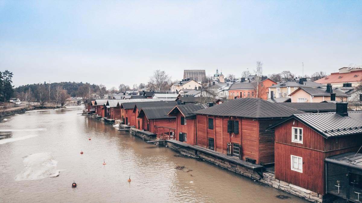 Porvoo: A beautiful collection of red wooden houses by the river in the Old Town.