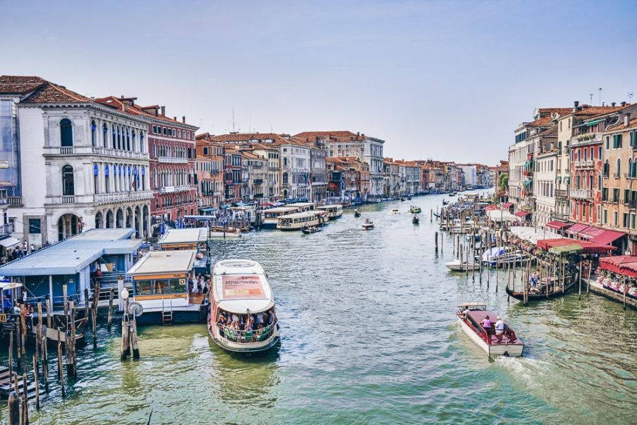 Boats, gondolas, sailing vessels and fantastic architecture on the Grand Canal in Venice.