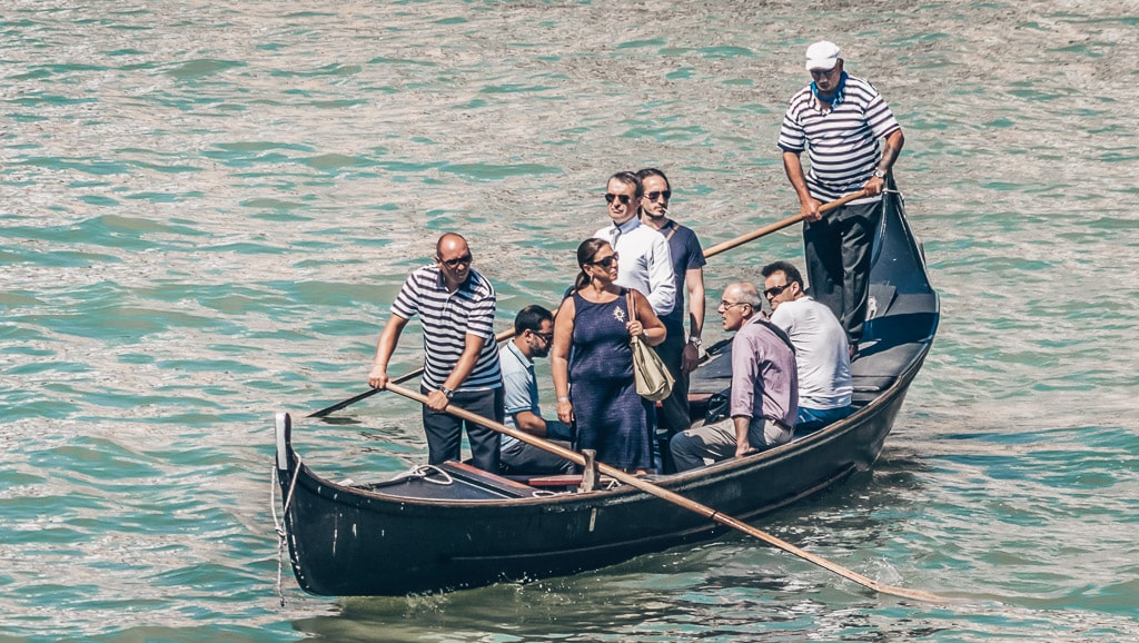 Passengers aboard a traghetto on the Grand Canal in Venice, Italy.
