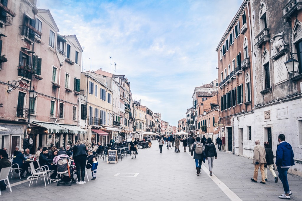 People walking along Via Garibaldi, the widest street in Venice, Italy.