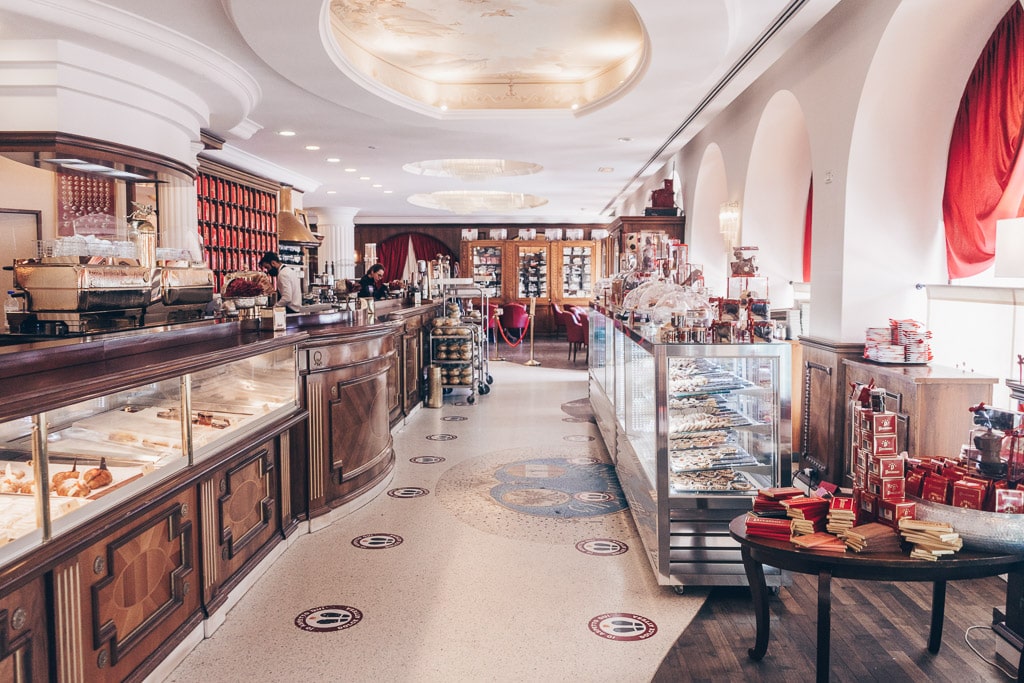 The grand interiors of the historic Caffè degli Specchi in Trieste, Italy.