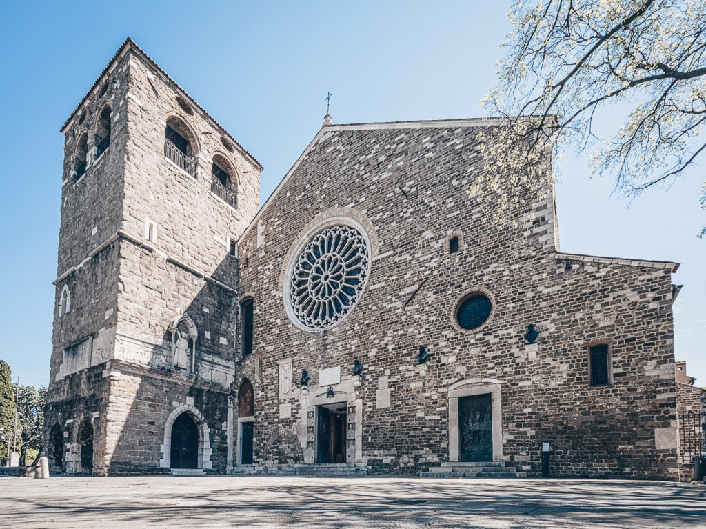 Exterior of the colossal Cathedral of San Giusto (Trieste Cathedral) in Trieste, Italy. PC: Sergio Delle Vedove/Shutterstock.com
