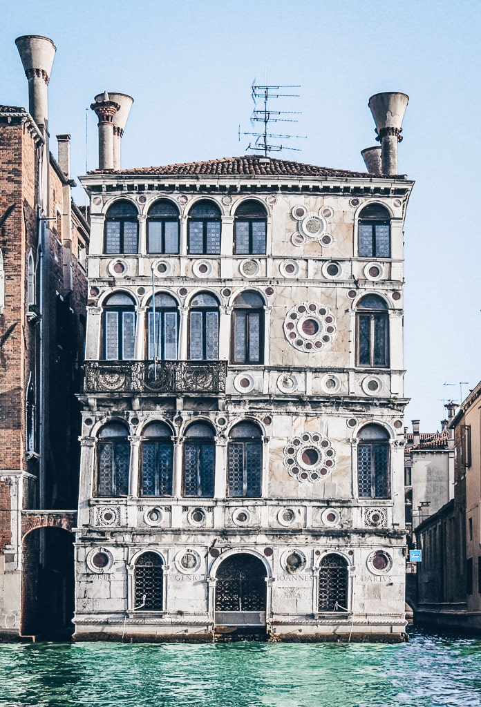 Venice palaces: The ornamental Renaissance façade of Palazzo Dario on the Grand Canal in Venice.