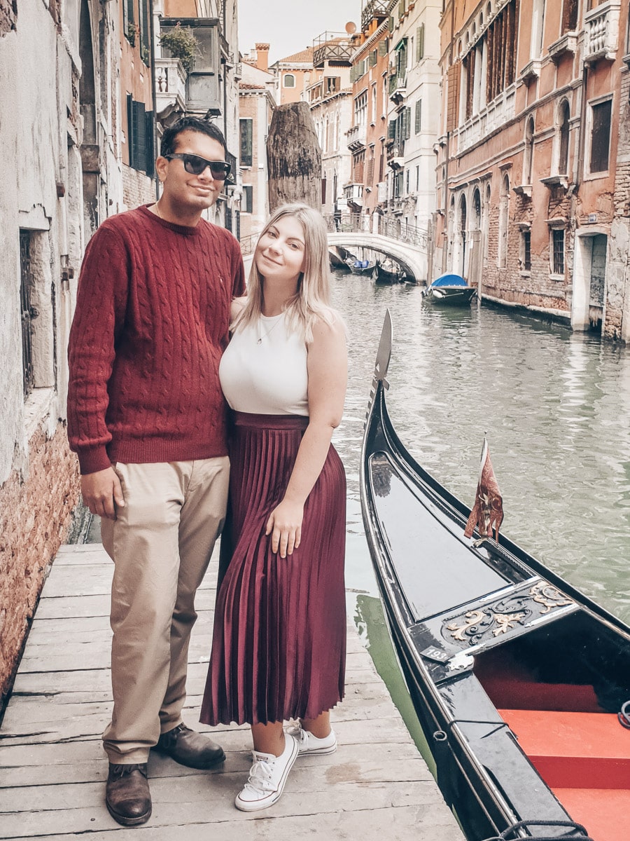 Venice Instagram Photo Spots: Couple posing for a picture on the famous pier Behind Hotel San Moise