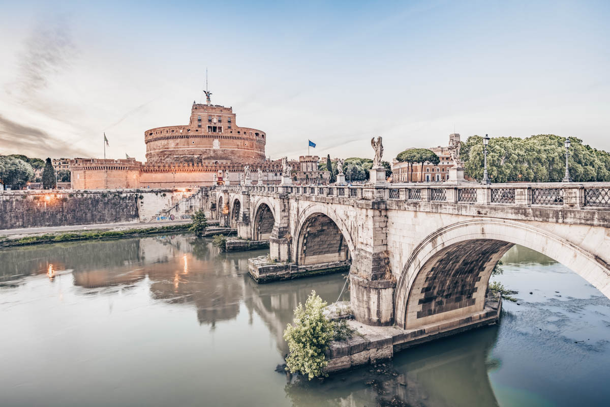 Things to do in Rome, Italy: Castel Sant' Angelo and Ponte Sant' Angelo at sunset