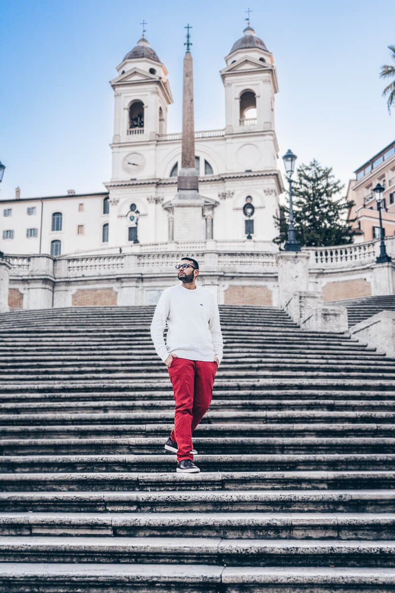Must-see Rome: Man walking down the iconic Spanish Steps at sunrise