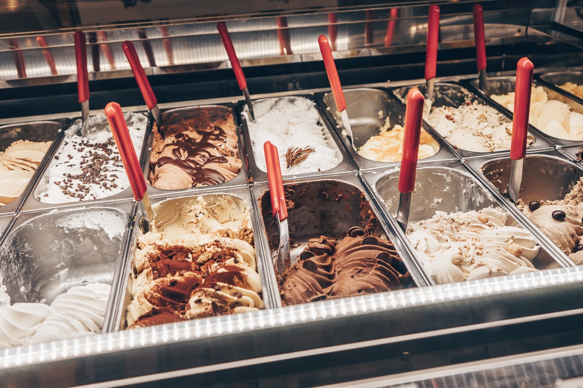 Swirls of richly colored gelato behind the counter at Günther gelateria in Rome, Italy