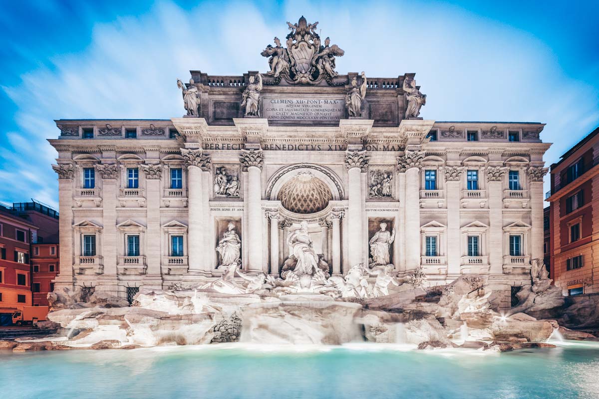 Places to visit in Rome: View of the famous Trevi Fountain at the blue hour