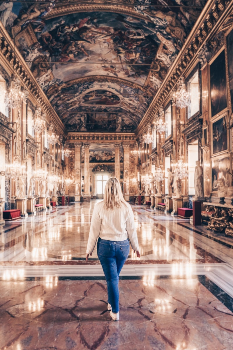 Colonna Palace, Rome: A woman posing for a photo in the spectacular Great Hall of Palazzo Colonna