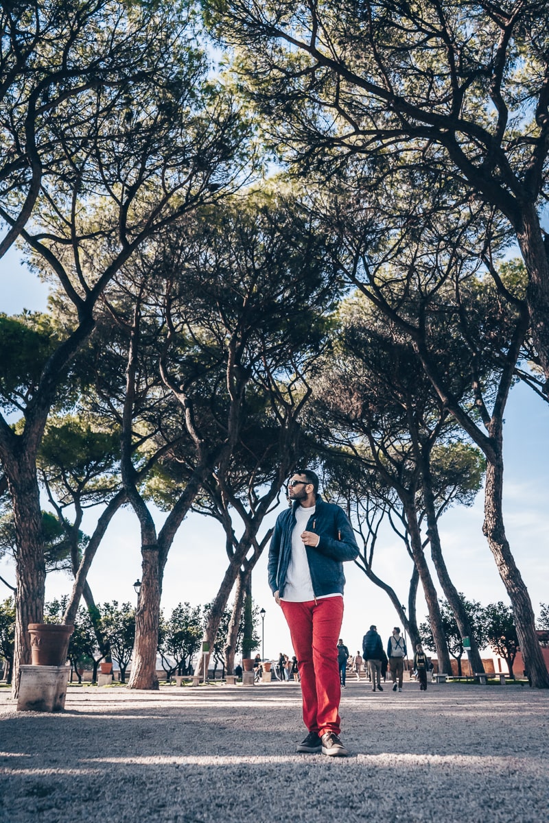 Best Rome viewpoints: Man posing for a photo in the lovely Orange Garden on Aventine Hill