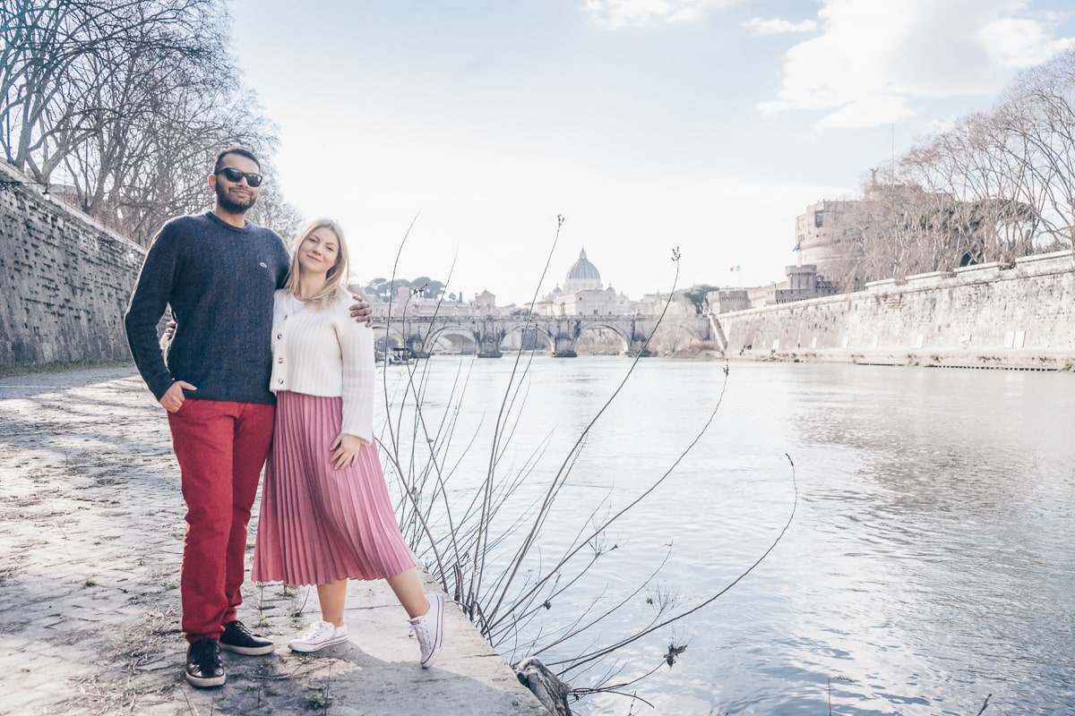 Best Rome photo spots: A couple posing for a photo on the Tiber riverbank on a sunny afternoon