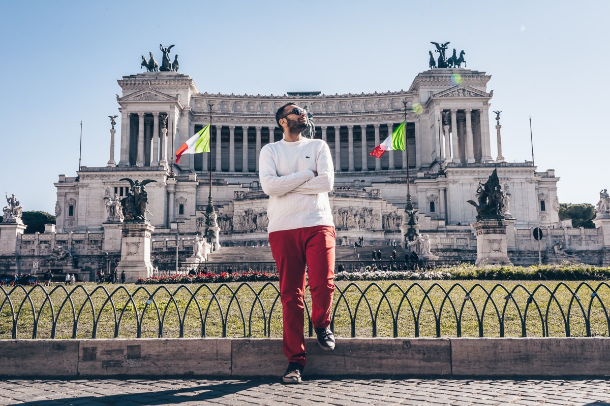 Rome Instagram Places: A man posing for a photo in front of the colossal Victor Emmanuel II Monument (Vittoriano)