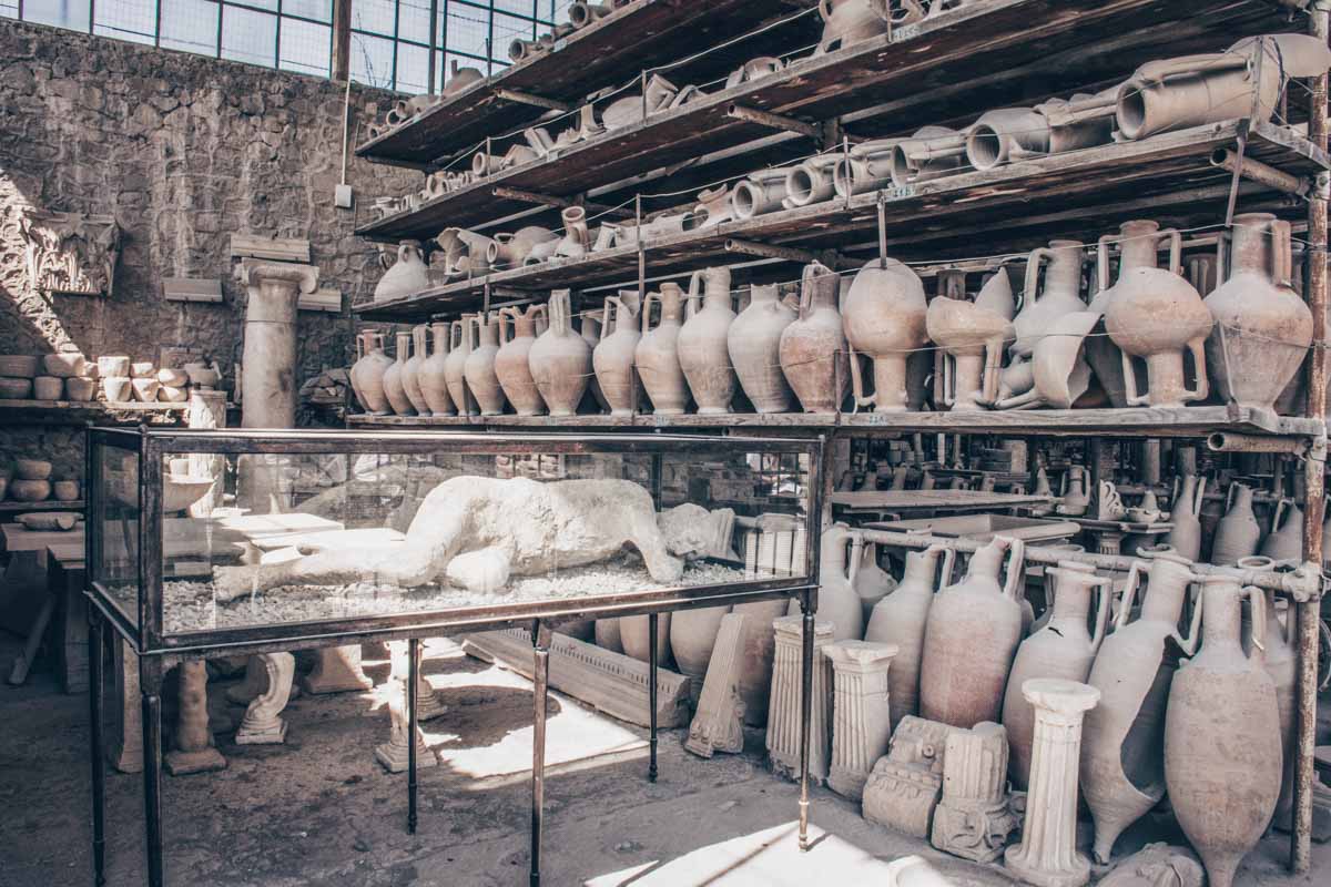 Household items and plaster casts in the granary of the Forum in the ancient city of Pompeii