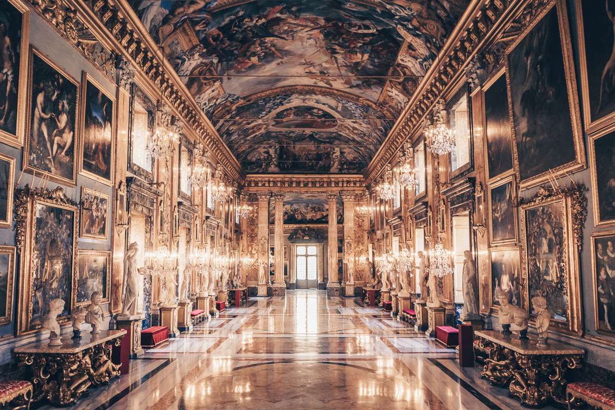 Colonna Palace: The Grand Hall with its ornate sculptures, marble floor, mirrors and colorful ceiling frescoes