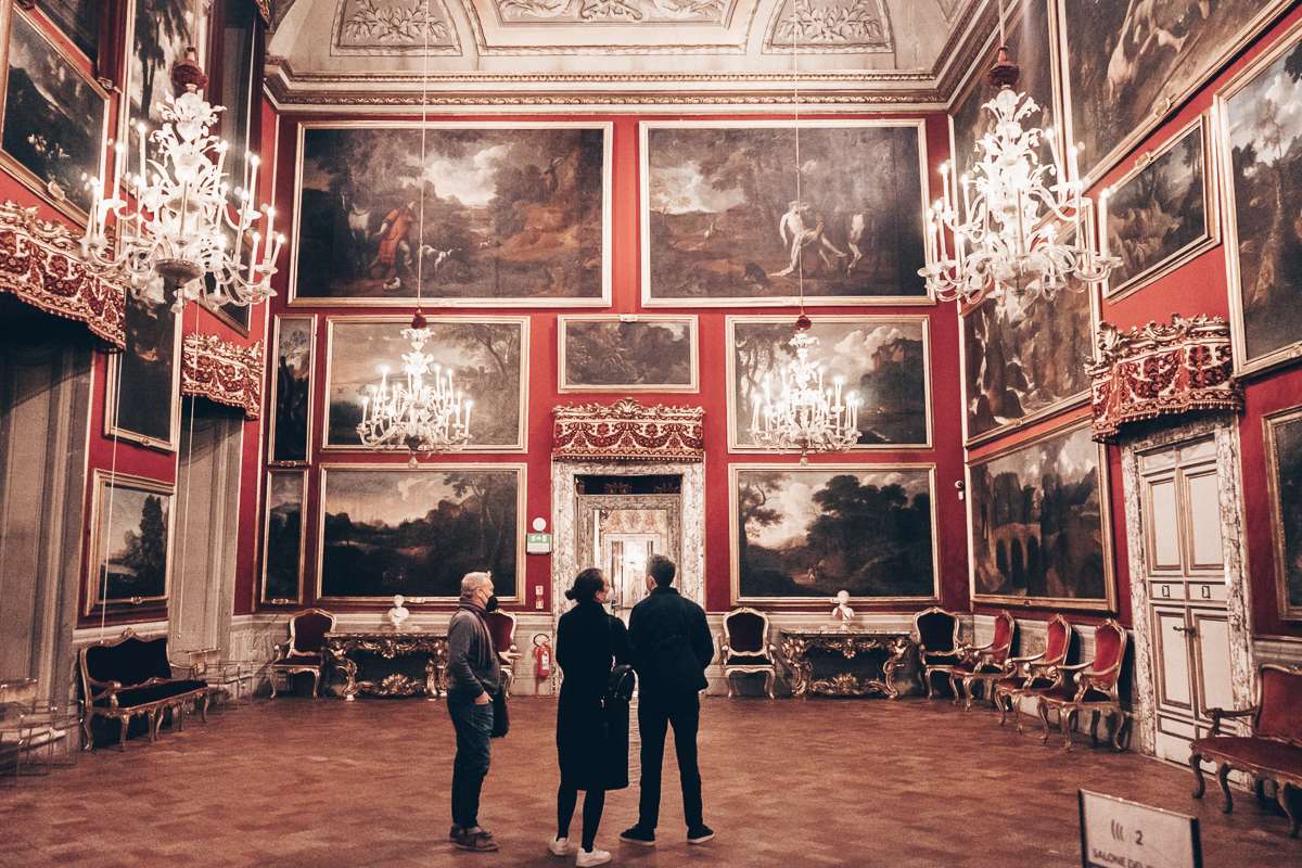 Rome attractions: People admiring various artworks on display in Doria Pamphilj Palace 
