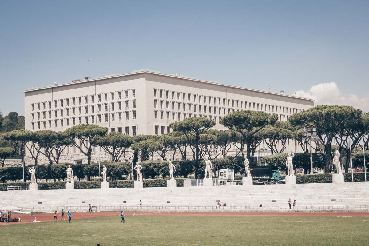 Rome Fascist architecture: Stadio dei Marmi, a small track and field arena in northern Rome. PC: Simone Ramella from Roma, Italy, CC BY 2.0 <https://creativecommons.org/licenses/by/2.0>, via Wikimedia Commons