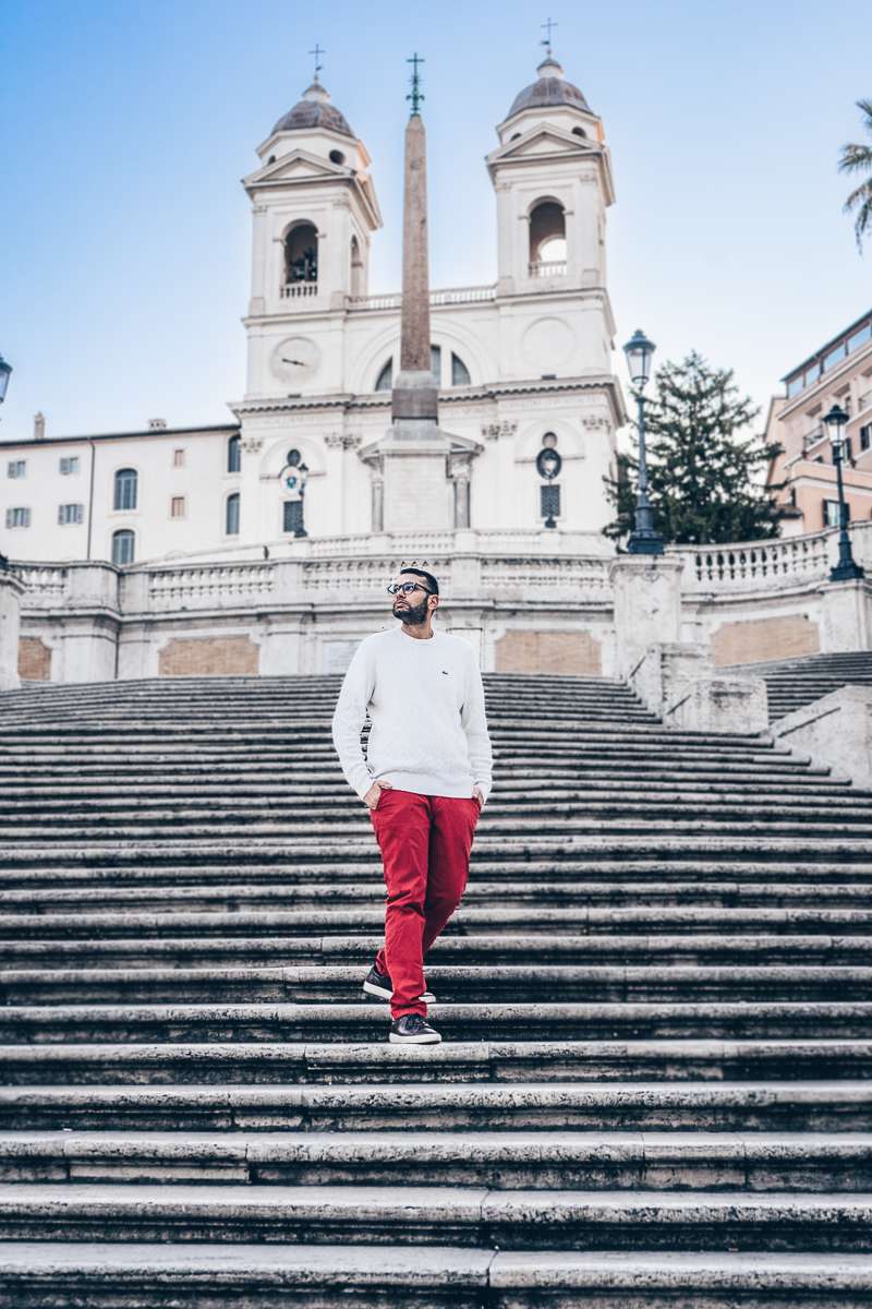 Must-see Rome: A man posing for a photo on the Spanish Steps at dawn