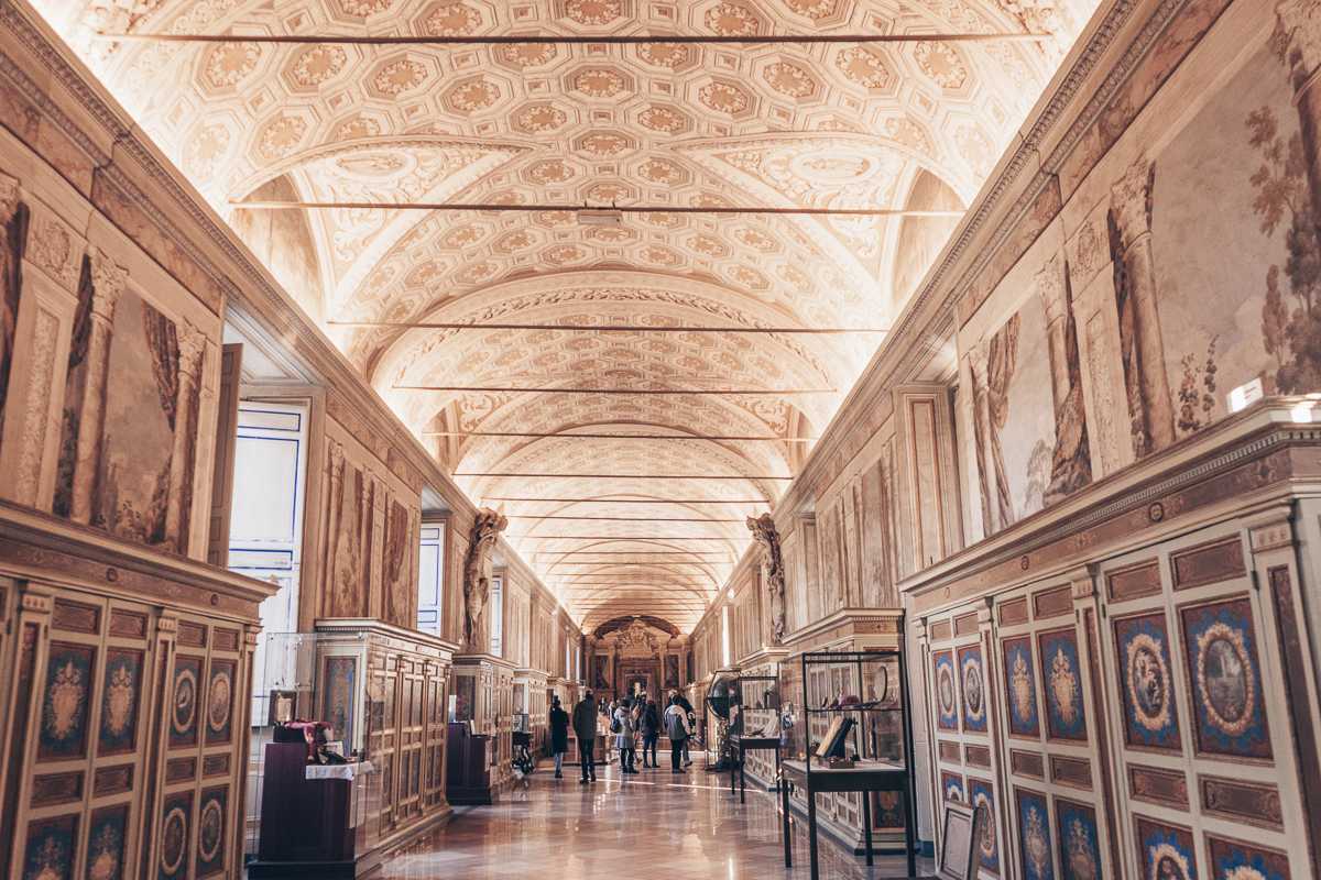 People admiring the stunning interiors of the Vatican Museums