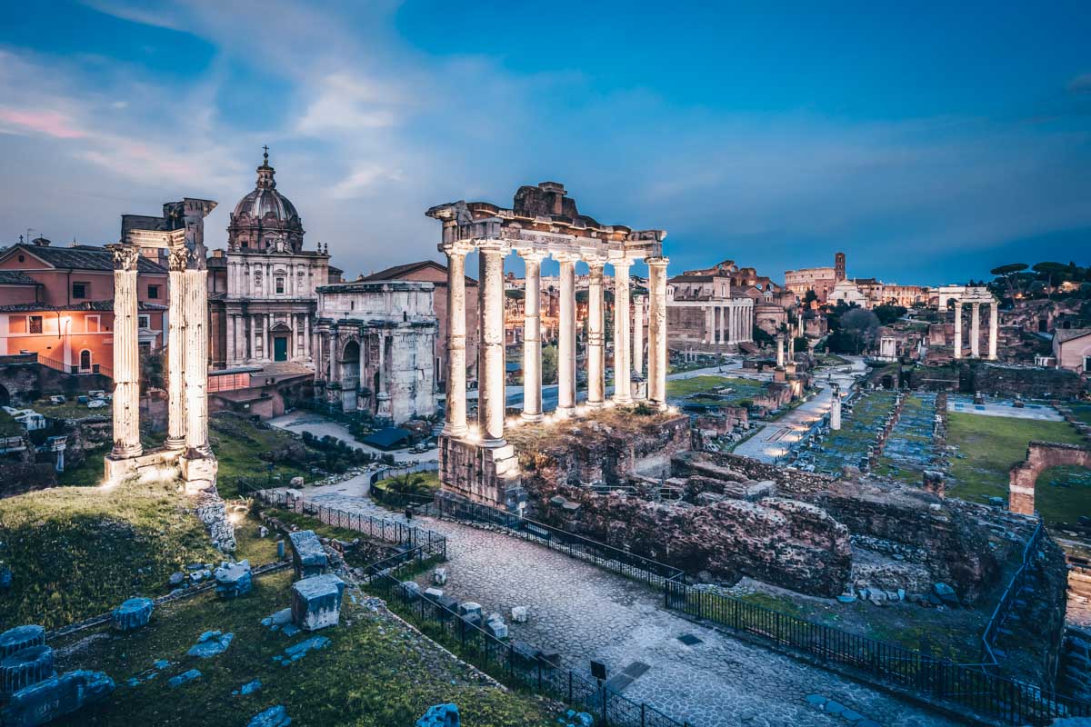 Rome viewpoints: View of the illuminated ruins of the Roman Forum at sunset from Piazza del Campidoglio
