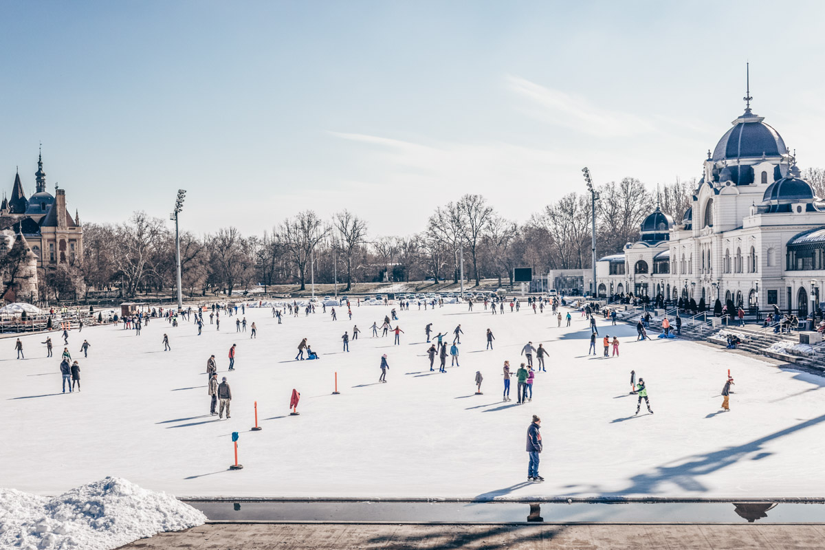 Budapest attractions: People skating on the ice rink in City Park on a sunny winter day